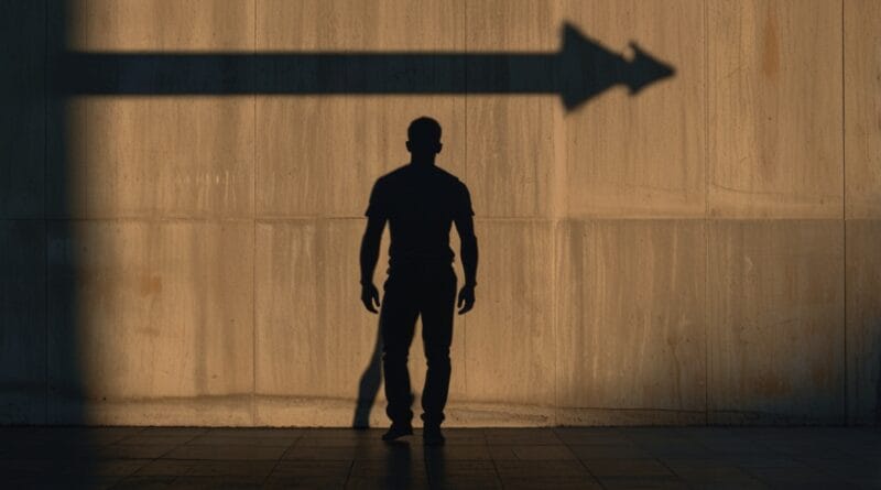 A strong upright shadow cast on a wall b 0